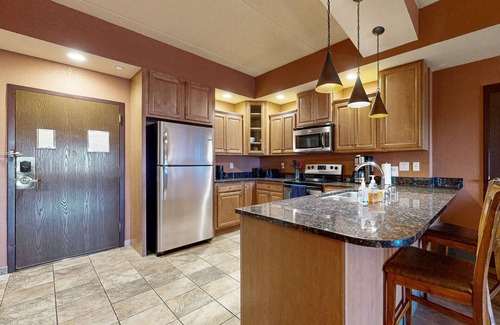 Wisconsin Dells Condo | Deluxe condo with in-room Jacuzzi, two fireplaces, & full kitchen