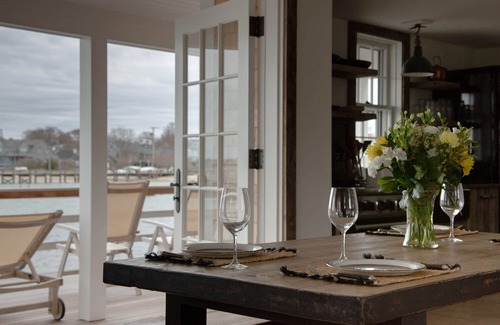Nantucket Town Cottage | Design cottage on wharf in town - huge private deck, private dock