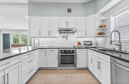 Lauderdale Isles House | Dockside Getaway: Waterfront Retreat with Kayaks & Golf Cart