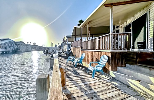 Port Isabel House | Dog-friendly bayfront home with in/outdoor pools, tennis, gym, W/D, bay views