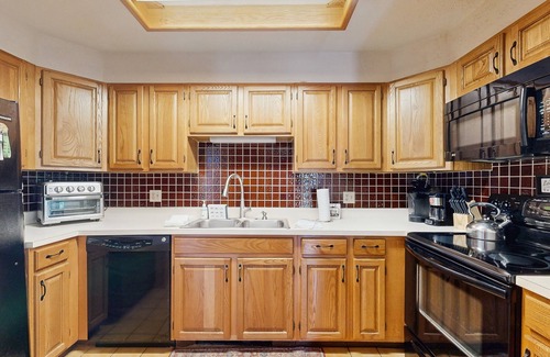 Jackson Condo | Dog-Friendly Condo with Patio, Wood Stove, Full Kitchen, W/D, & Free WiFi