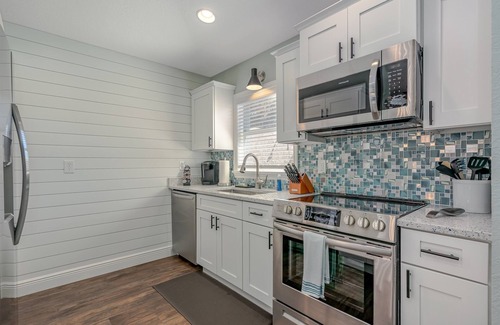 New Smyrna Beach House | Dog Friendly Home w/Private Fenced Yard, Garage & Fire Pit! STEPS to the Beach!