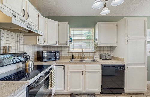 Butler Beach House | Dog-Friendly home with enclosed backyard, private hottub and sunroom