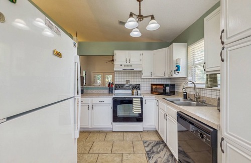 Butler Beach House | Dog-Friendly home with enclosed backyard, private hottub and sunroom