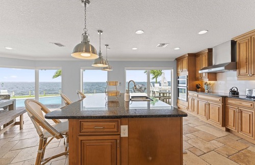 Cocoa Isles Country Club House | Dolphin Paradise-5 BDRM-Riverfront-Pool-Game Room