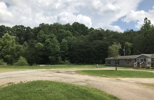 Nelsonville House | Dorr Run Retreat A cozy home nestled in the woods with a pond. ATV friendly!