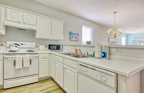 Sunset Beach Condo | Dreamy lakefront condo near the beach with WiFi, private patio & shared pool