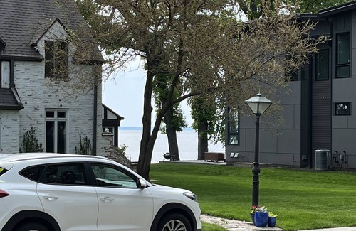 Oshkosh House | EAA rental near airport w/firepit, backyard, peekaboo lake view, and a clear sky
