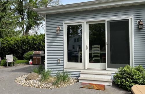 Oshkosh House | EAA rental near airport w/firepit, backyard, peekaboo lake view, and a clear sky