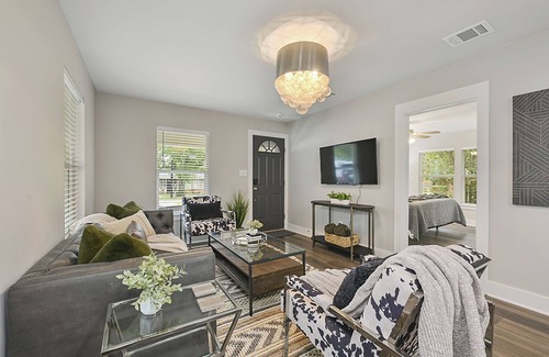 Bryan House | East 27th Bungalow 2 BR, 1 BA, Fully Remodeled, Large Yard and Covered Patio