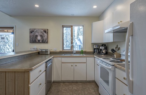 Silver Star Mountain House | Easy ski-in and ski out from this home with private hot tub, laundry & fireplace