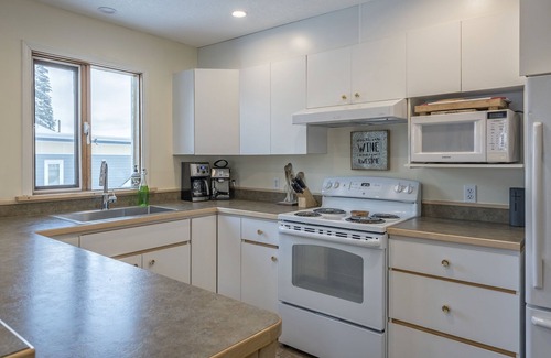 Silver Star Mountain House | Easy ski-in and ski out from this home with private hot tub, laundry & fireplace