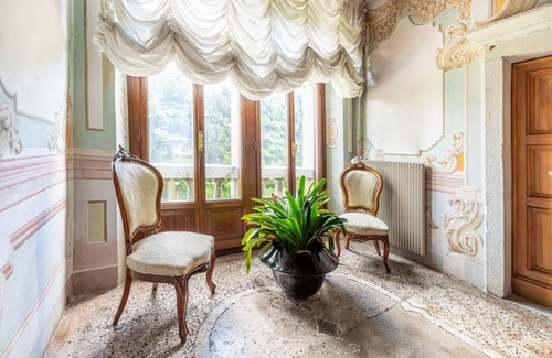 Belluno Apartment | Elegant 350 sqm apartment for 6 people, located on two levels of a historic 18th century villa. The villa, with fine furnishings and frescoed galleries, will enchant you with its rooms, where history and comfort blend to give you an unforgettable experie