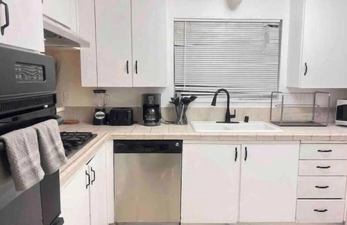 Riverside House | Elegant 5-Bedroom Riverside home with BBQ, AC, WiFi, Fitness, amenities and more