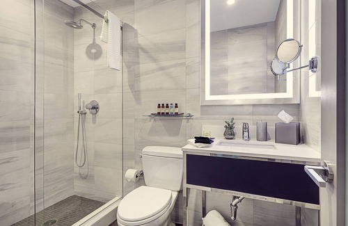 Financial District Hotel | Elegant and Spacious Room with Two Queen Beds for Ultimate Relaxation