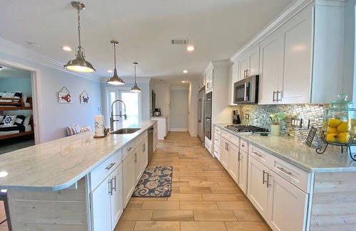 Pensacola Beach House | Elegantly decorated 3 bdr/3.5 bath home in gated community w/pool & pier.