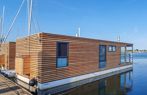Lelystad Boat Rental | Enjoy a vacation on the water in this inviting houseboat in Lelystad.