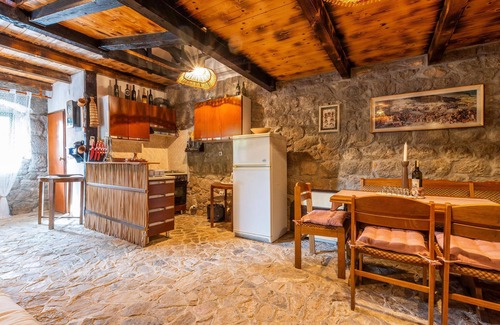 Vrgorac House | Enjoy a wonderful view of the countryside from this inviting vacation home with pool access.