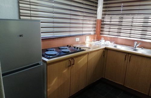 Graskop House | Enjoy the beauty of nature, see the mountain view when standing outside.