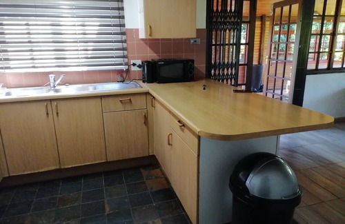 Graskop House | Enjoy the beauty of nature, see the mountain view when standing outside.