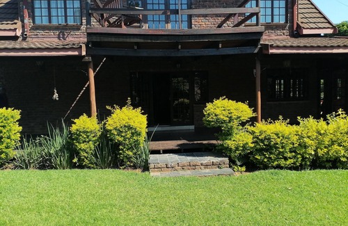 Graskop House | Enjoy the beauty of nature, see the mountain view when standing outside.