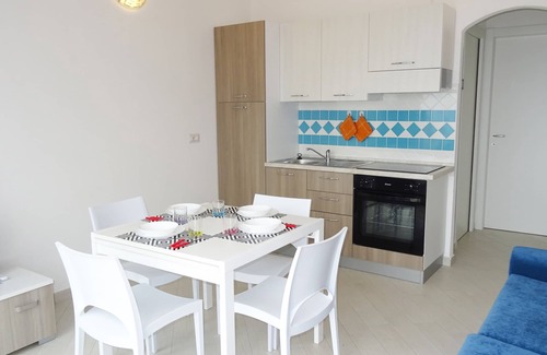 Paduledda Apartment | Equipped one-bedroom apartment with charming sea view, shared pool and washing machine