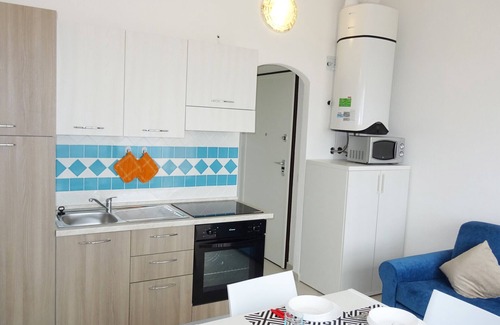 Paduledda Apartment | Equipped one-bedroom apartment with charming sea view, shared pool and washing machine