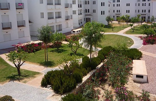 Roldan Apartment | Great views over pools, golf course, lake & mountains from sunny balcony