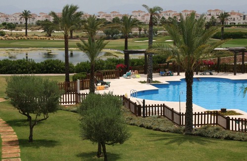 Roldan Apartment | Great views over pools, golf course, lake & mountains from sunny balcony