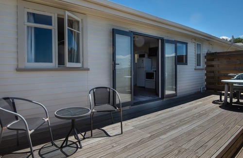 Tasman Cabin | Escape to the tranquil Helme Holiday Bottom Bach, kiwi charm on beautiful Kina Peninsula