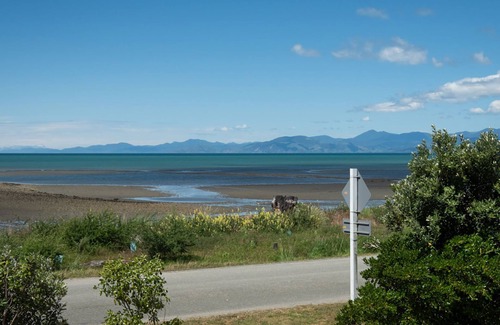 Tasman Cabin | Escape to the tranquil Helme Holiday Bottom Bach, kiwi charm on beautiful Kina Peninsula