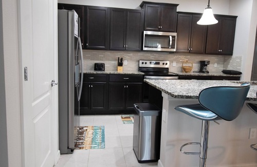 Windsor Hills House | Family Oasis! Luxe 5BD/4.5BA Townhouse w/Private pool, Disney Proximity