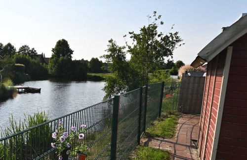 Papenburg House | Feel-good vacation home with a view of the natural lake from the terrace
