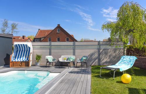 Bensersiel Apartment | Ferienwohnung Haus zum Seehund mit Pool und Frühstücksoption