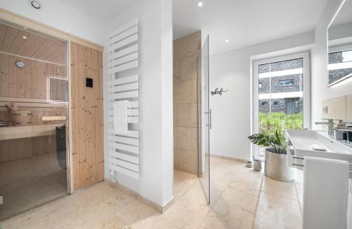 Kappeln Apartment | Ferienwohnung Nordglanz – Modernes Beachhouse-Flair im Herzen des OstseeResort Olpenitz