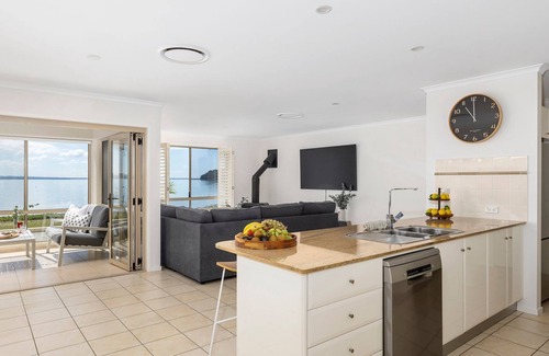 Salamander Bay House | Foreshore Delight offers a tranquil holiday retreat with breathtaking water views