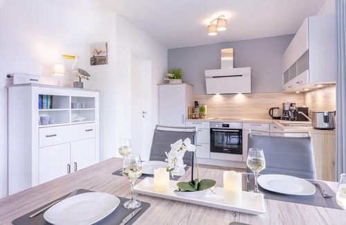 Wangerland Apartment | Friesenkoje vacation apartment: modern relaxation on the North Sea coast.