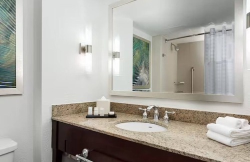 Florida Central Atlantic Coast Hotel | Fun-Filled Resort Getaway l 4 Spacious Suites + Free Breakfast & Park Shuttle