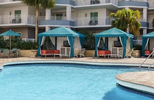 Florida Central Atlantic Coast Hotel | Fun-Filled Resort Getaway l 4 Spacious Suites + Free Breakfast & Park Shuttle