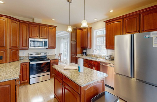 Livingston House | Fun & relaxing getaway with 2 game rooms, fire pits, deck, & more