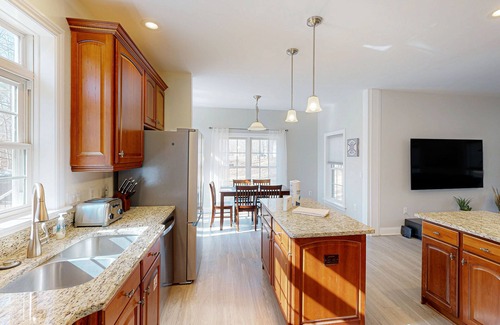 Livingston House | Fun & relaxing getaway with 2 game rooms, fire pits, deck, & more