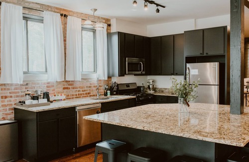 West Lakeview Condo | Gather Together & WFH in Piece of Chicago History