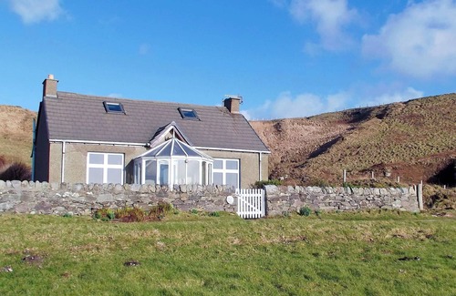 Bellochantuy Cottage | A detached cottage with views across to Gigha and the Paps of Jura.