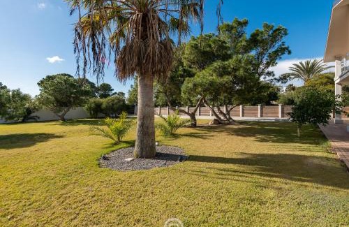 Porto Pino House | Golden Dunes Villa - Garden Retreat