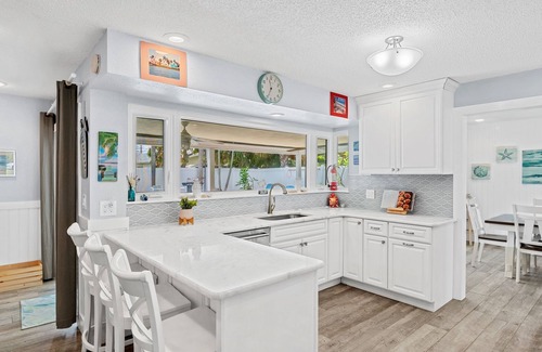 Venetian Way House | Gorgeous Beach House W/Large Outdoor Patio, Heated Pool & Gas Fire Pit!