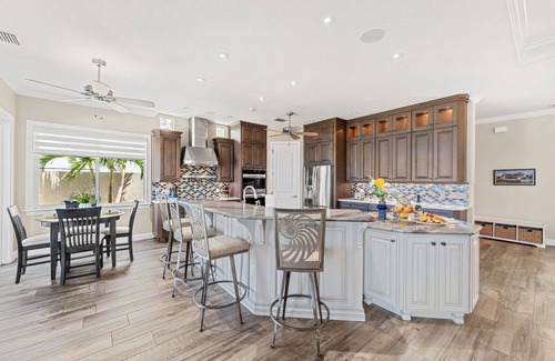 Cocoa Isles Country Club House | Gorgeous Direct Riverfront Pool Home W/Private Balcony, Movie Room, & Fire Pit!