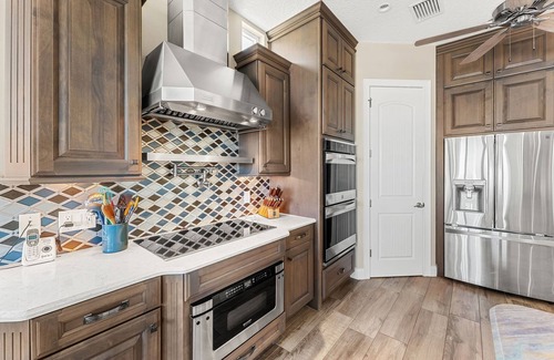 Cocoa Isles Country Club House | Gorgeous Direct Riverfront Pool Home W/Private Balcony, Movie Room, & Fire Pit!