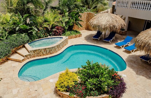 Bubali Apartment | Gorgeous modern 1-bedroom apartment with tropical garden, pool and whirlpool