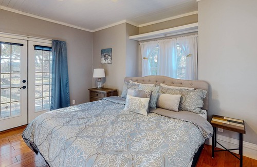 Holiday Island House | Gorgeous water view home with a fireplace, outdoor space & central AC