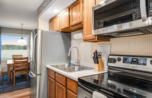 Three Lakes Cabin | Gorgeous water views, deck, private boat slip, indoor pool, hot tubs, & gym